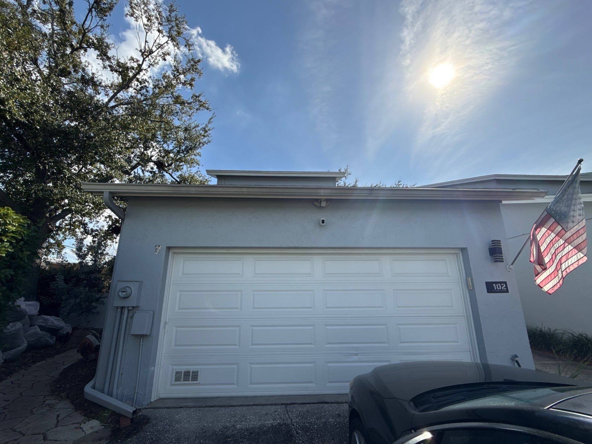 Exterior view of the residential property during the initial site survey for water damage remediation planning.