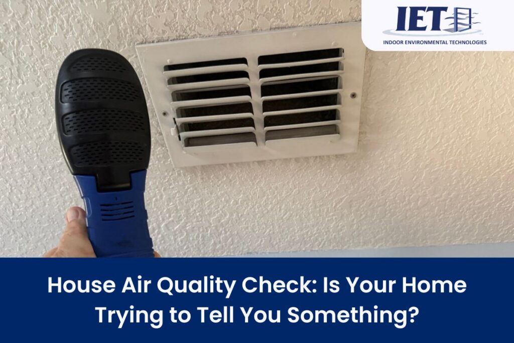 Air quality check in a home with a handheld testing device aimed at an air vent, focusing on ensuring clean air and diagnosing potential air quality issues.