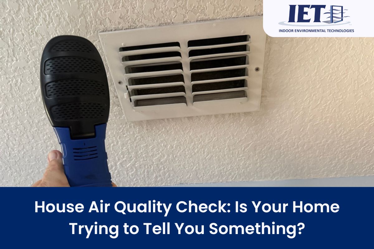 Air quality check in a home with a handheld testing device aimed at an air vent, focusing on ensuring clean air and diagnosing potential air quality issues.