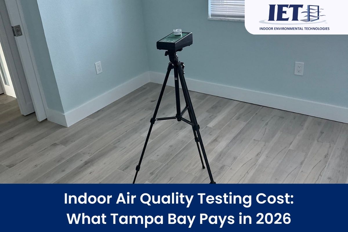 Professional indoor air quality testing equipment set up in a room.