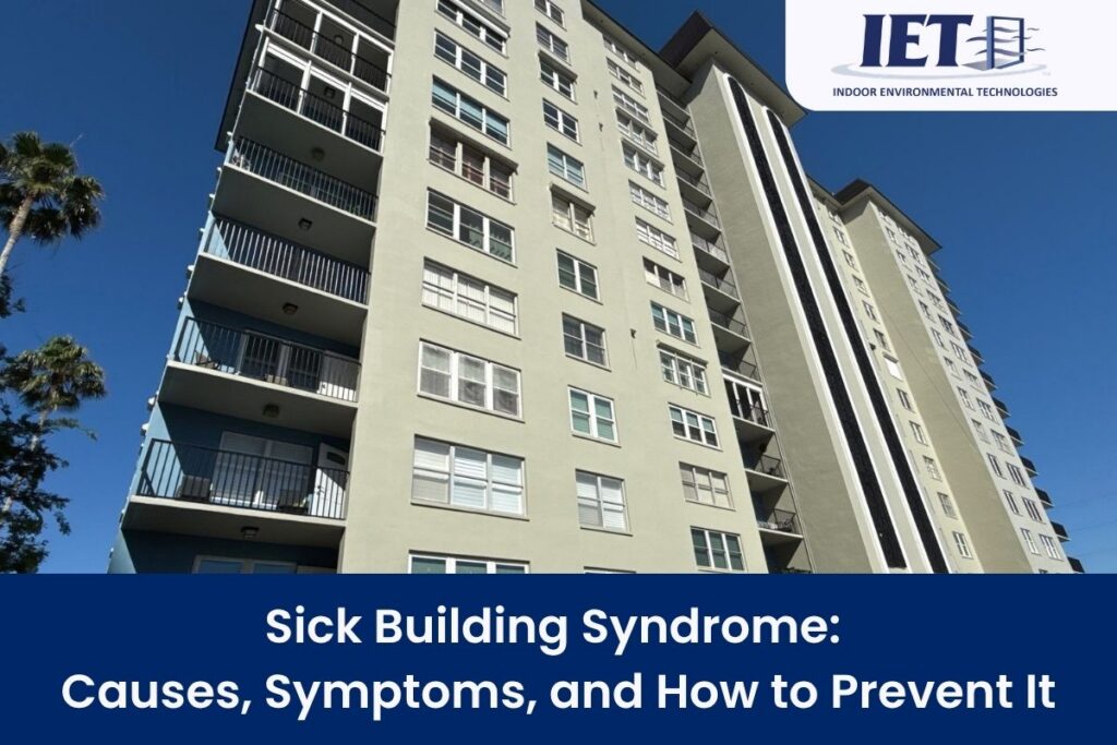 Tall apartment building with balconies against a blue sky, illustrating Sick Building Syndrome.