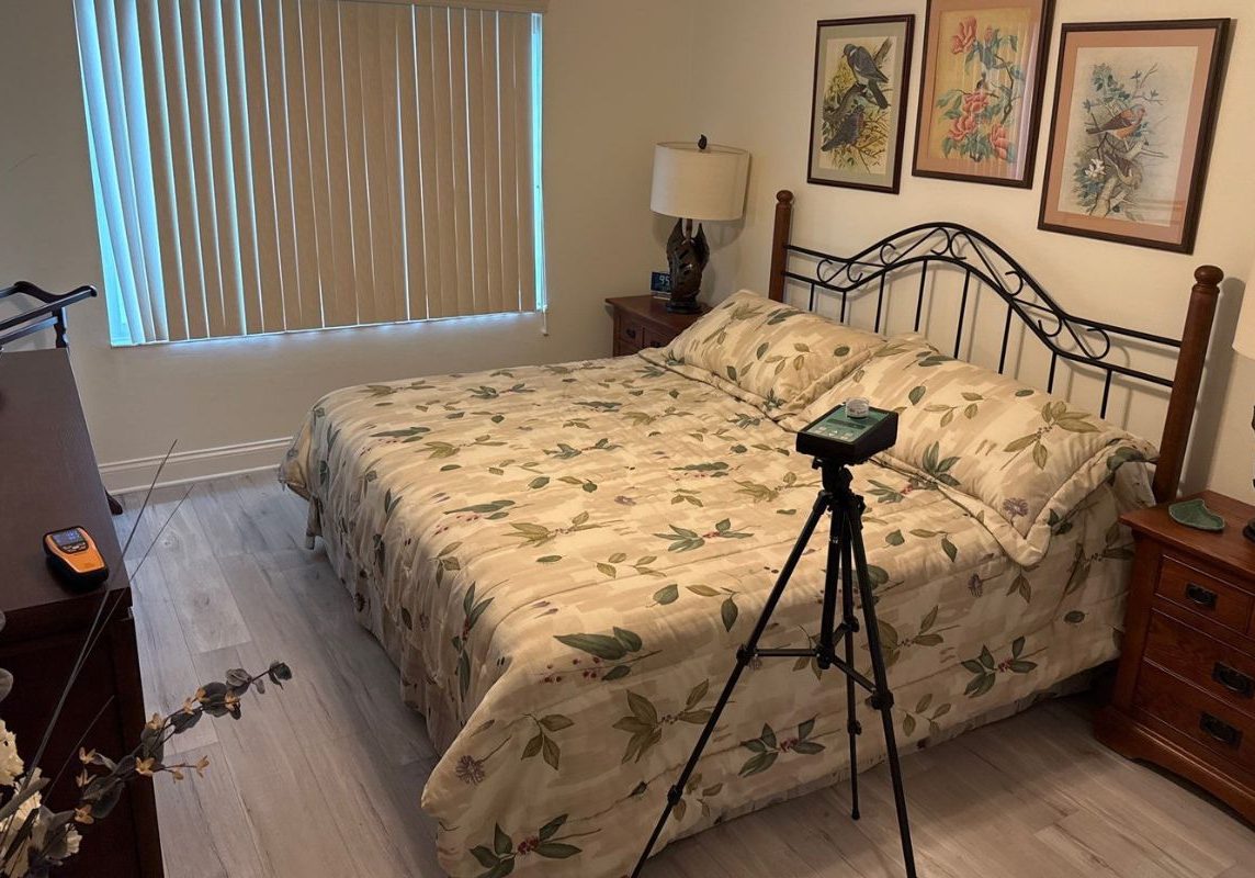 Bedroom mold inspection equipment set up near a bed, showing indoor air quality testing tools used to assess possible mold, moisture, and environmental concerns in a residential home.
