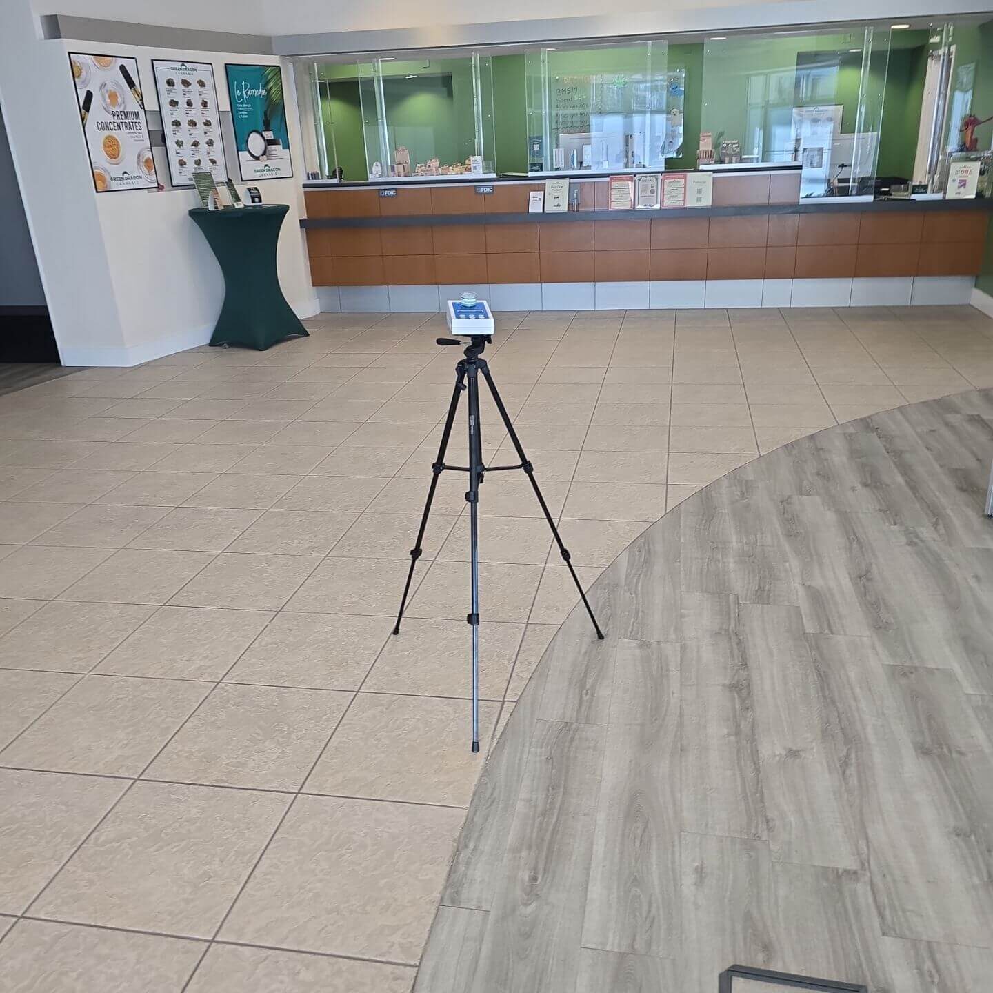 Professional environmental testing equipment conducting an industrial hygiene survey in a large retail or commercial facility.