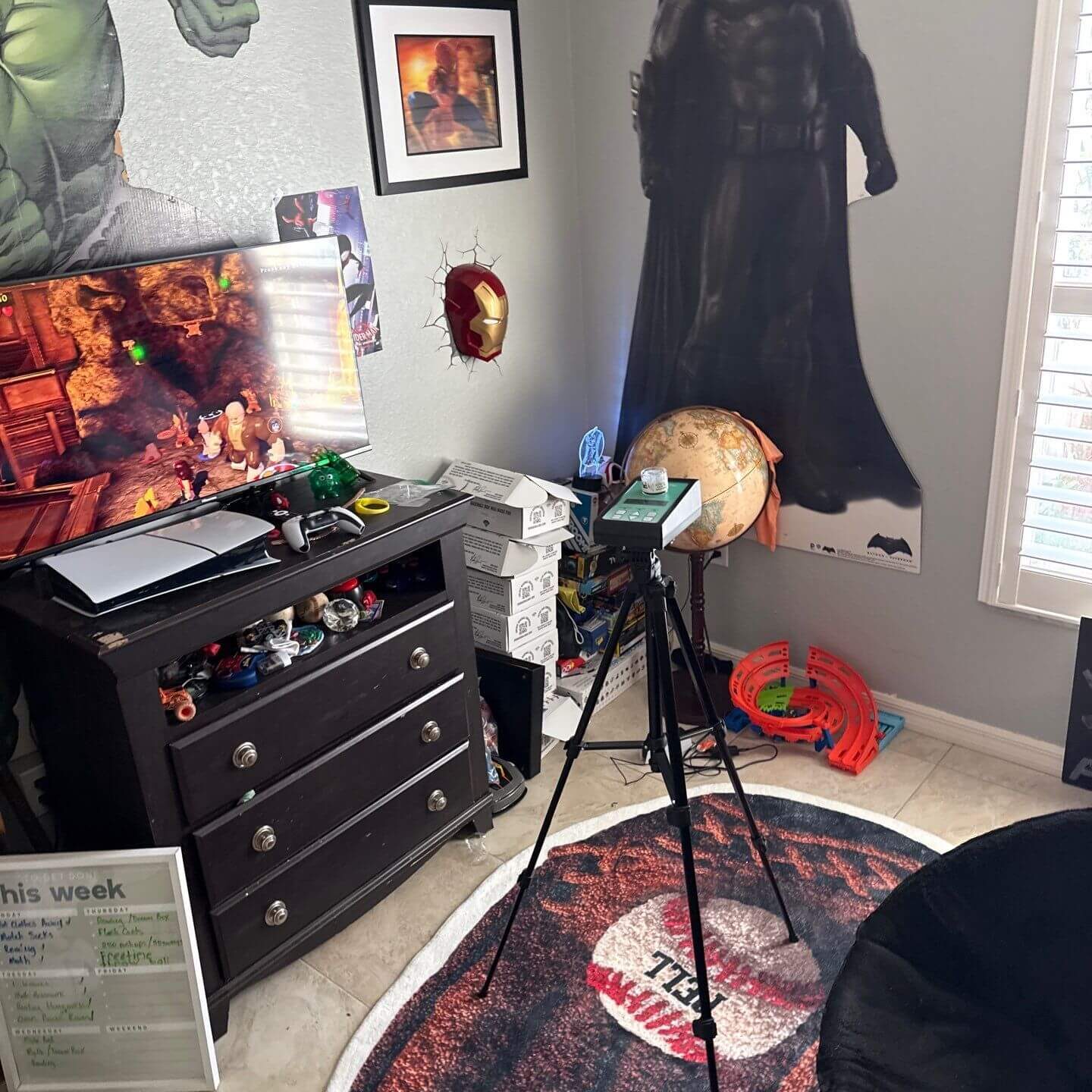 High-volume air sampling pump on a tripod in a bedroom for mold spore and allergen laboratory analysis.